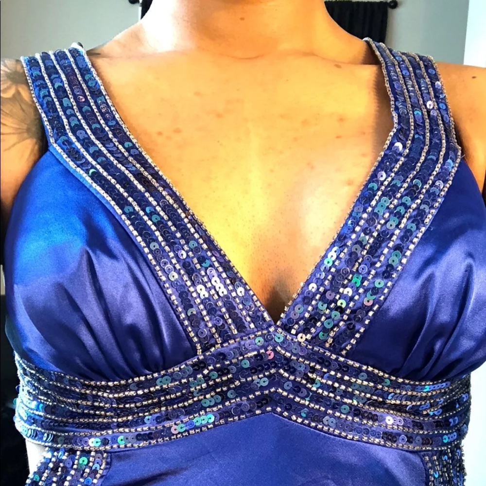 Blue sequined prom dress .
